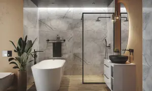 Nowoczesna łazienka z wolnostojącą wanną, prysznicem walk-in i umywalką nablatową. Zwraca uwagę elegancka wysokość wanny, idealnie dopasowana do reszty aranżacji.