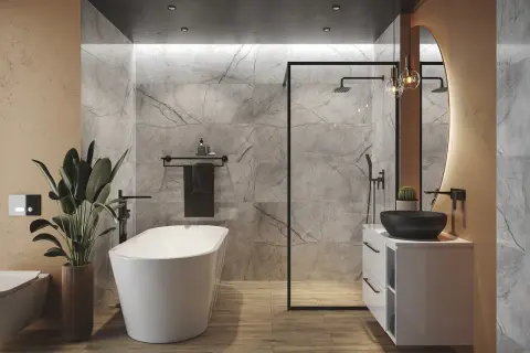 Nowoczesna łazienka z wolnostojącą wanną, prysznicem walk-in i umywalką nablatową. Zwraca uwagę elegancka wysokość wanny, idealnie dopasowana do reszty aranżacji.
