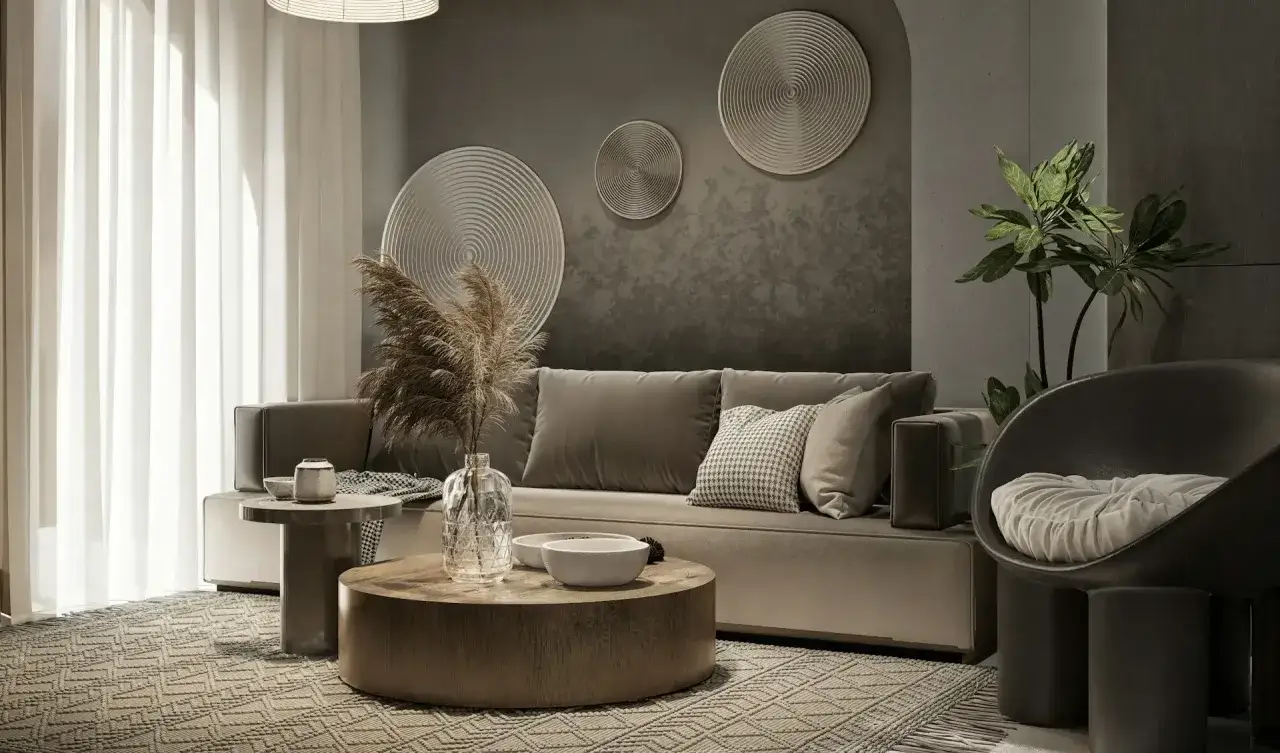 Nowoczesny salon z szarą sofą i dywanem o geometrycznym wzorze. Inspiracja, jak dobrać dywan do salonu, by stworzyć przytulną atmosferę.