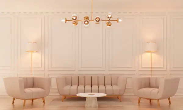 Elegancki salon w stylu glamour z beżową kanapą, dwoma fotelami, okrągłym stolikiem i złotą lampą.